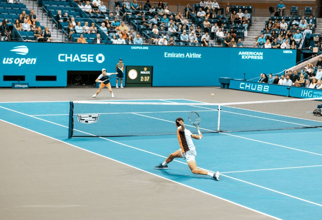 Demo Post 1 Dynamic scene of players in action at the US Open on a bright tennis court.